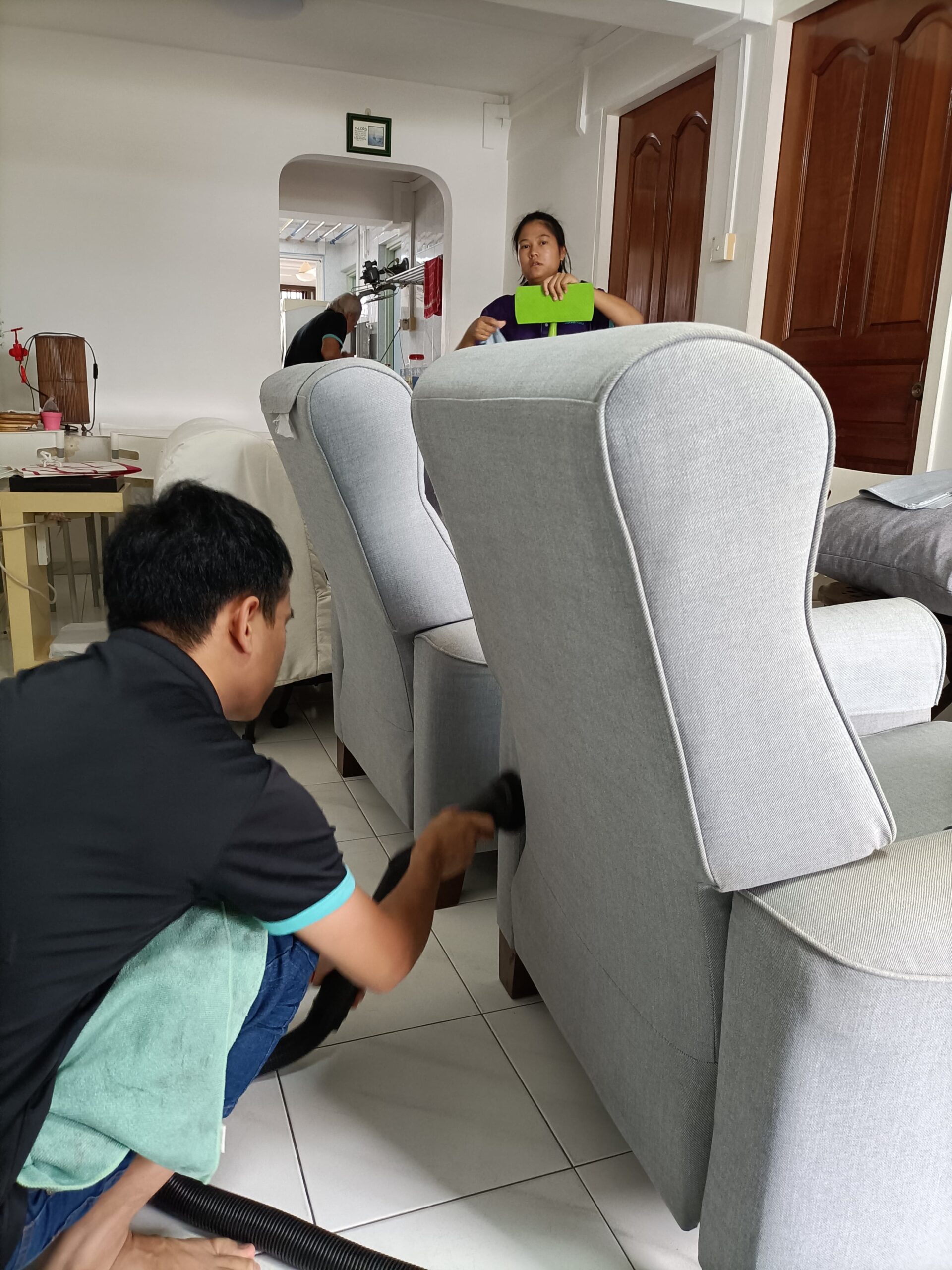 Professional cleaning a sofa