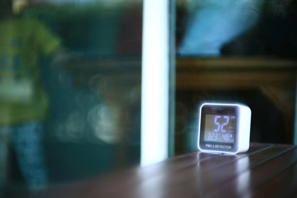 Selective focus of air detector on a table with a blurred background.