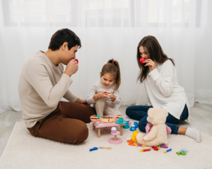 Daughter and parents playing together at home.