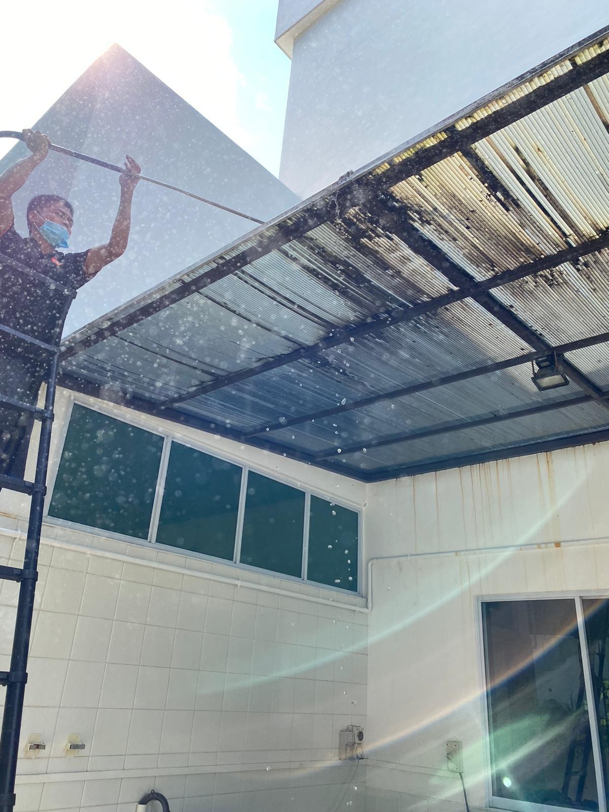 man cleaning the roof