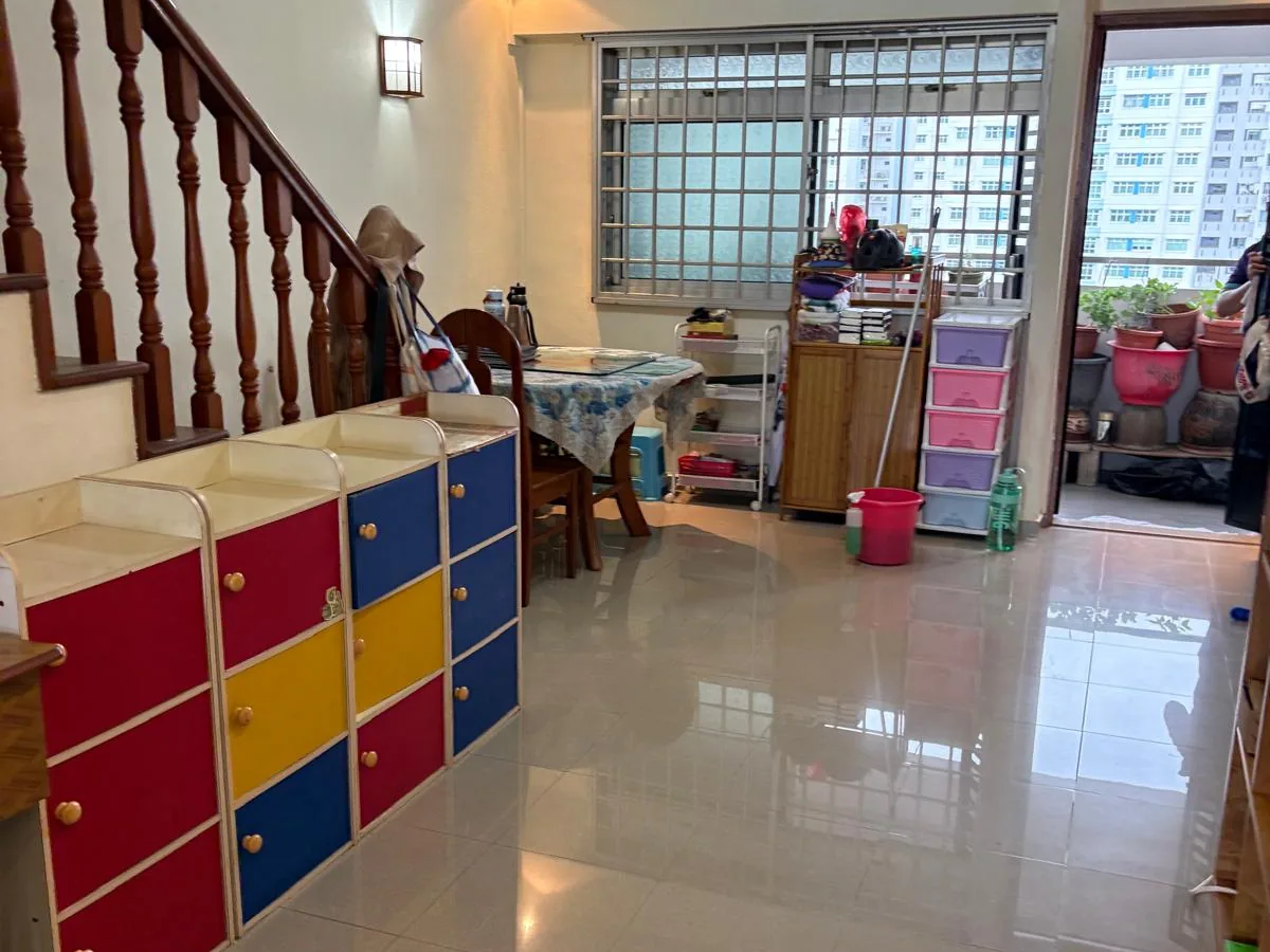 Entryway and staircase after decluttering, with colourful storage drawers now visible