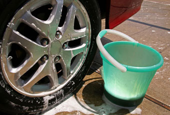 wash car with pail of water